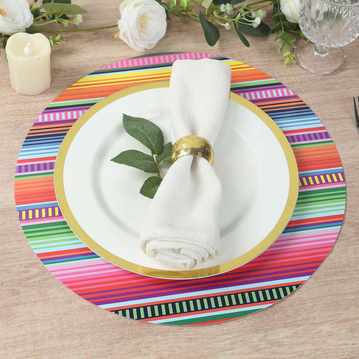 Colorful striped charger plate with white dinner plate and napkin arrangement.
