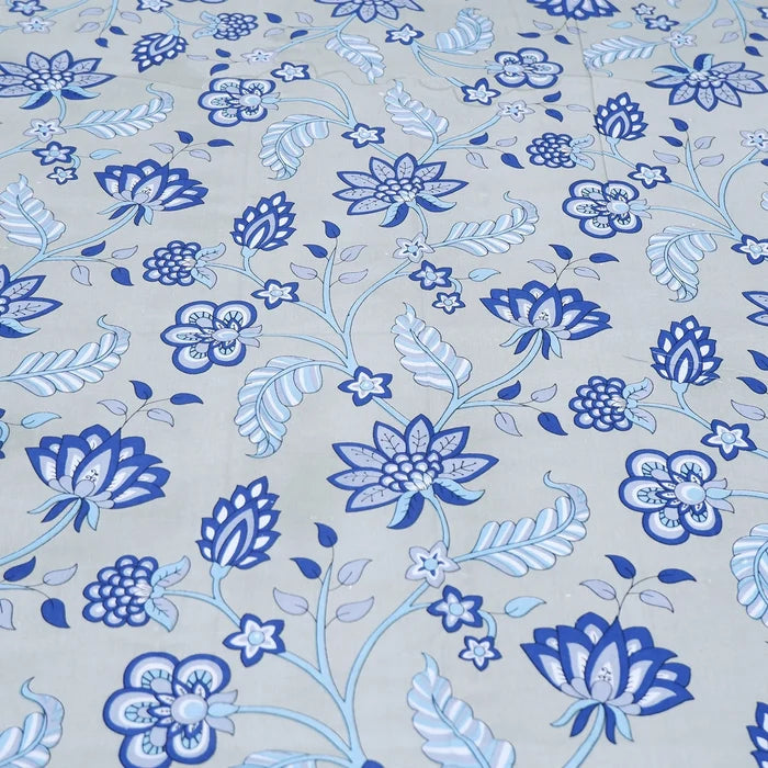The Jaipuri pure cotton bed sheet with floral blue pattern on a light background
