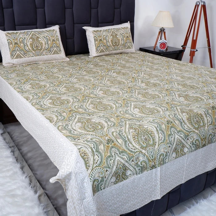 Jaipuri cotton bed sheet in green paisley pattern with matching pillow covers on a modern bed