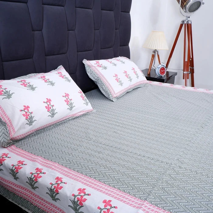 Pure cotton bed sheet Jaipur featuring floral patterns and matching pillowcases for a stylish bedroom look