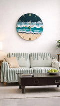 Living room with a decorative wall clock featuring an ocean design, a sofa, and a coffee table.