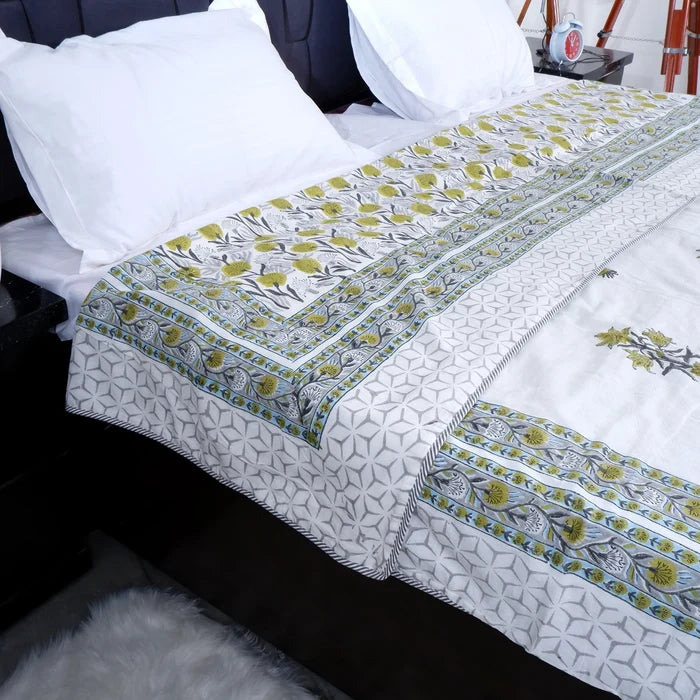Hand block print mulmul dohar in green and white floral design, perfect for cozy bedding.