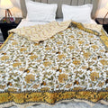 Jaipuri cotton quilt double bed featuring vibrant floral patterns and intricately designed borders