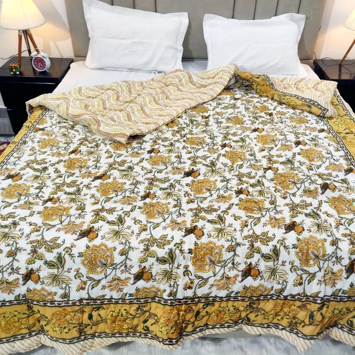 Jaipuri cotton quilt double bed featuring vibrant floral patterns and intricately designed borders