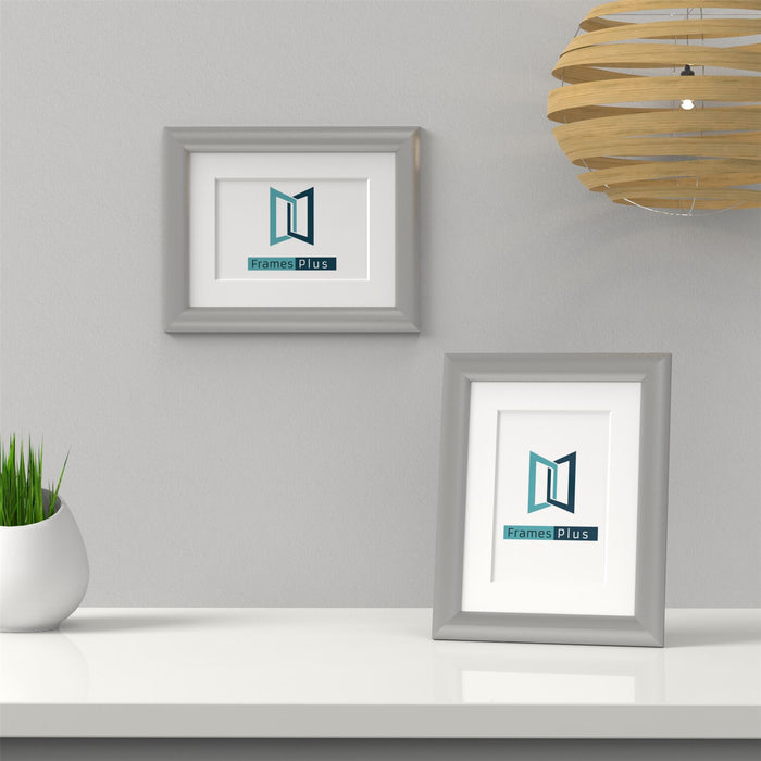Silver picture frame with white mount showcasing Frames Plus logo on a clean, modern display.