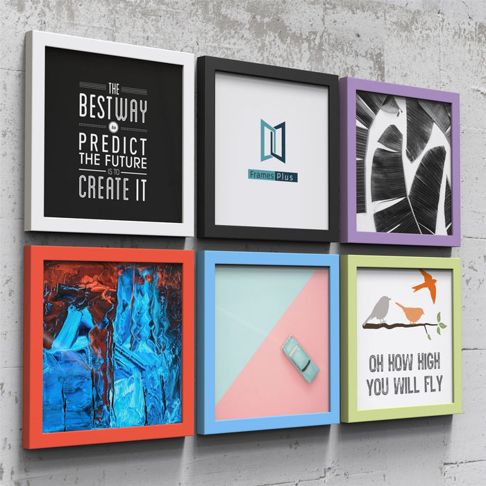 Colorful blue picture and poster frame display with various creative artworks on a concrete wall.