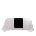 Black table runner on a white tablecloth for elegant dining decor. #whtbkgd
