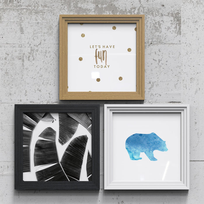 Stylish and modern white picture frame set showcasing various artwork and designs for home decor.