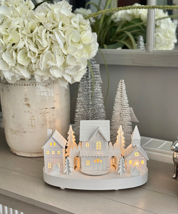 White Wooden Christmas Village Scene With Moving Train And Lights.