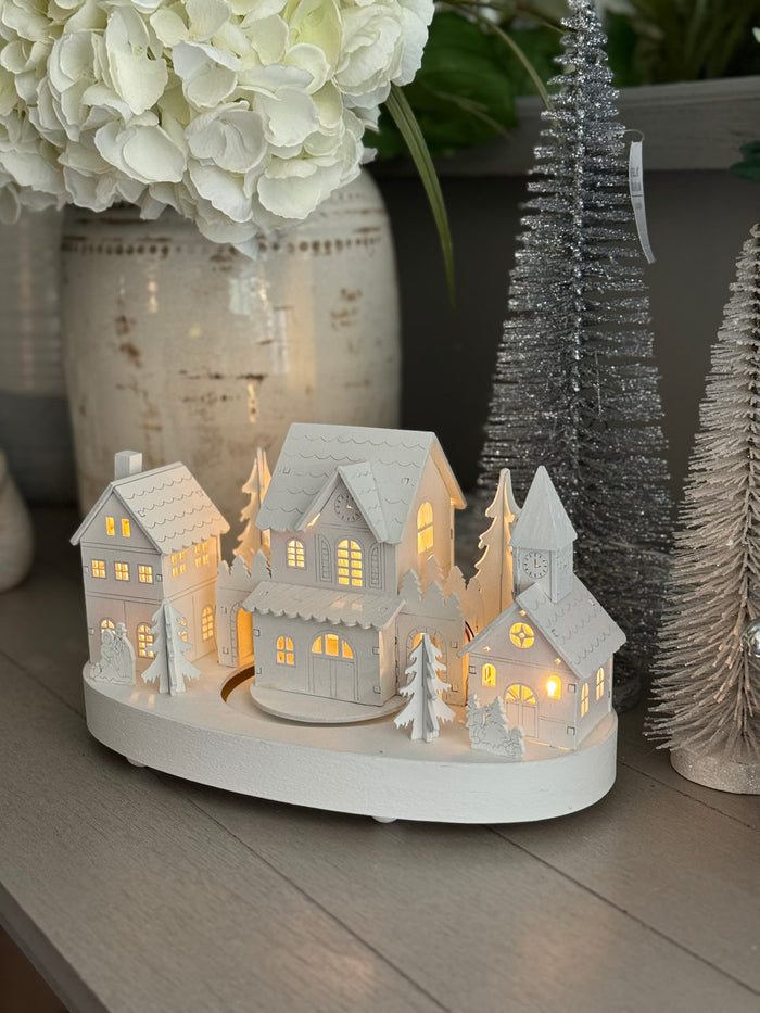 White Wooden Christmas Village Scene With Moving Train And Lights.